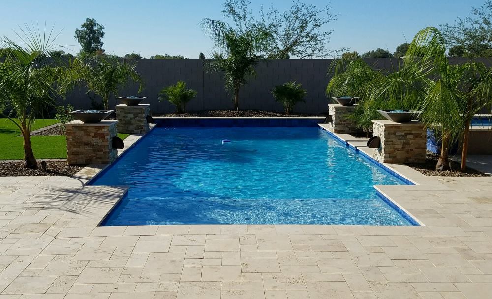 Backyard swimming pool and decking built by Saturn Pool Company in Arizona